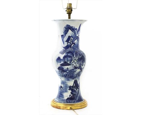 A Chinese blue and white vase, 19th century, of gu form, decorated with figures in riverside and mountainous landscapes, 43.5