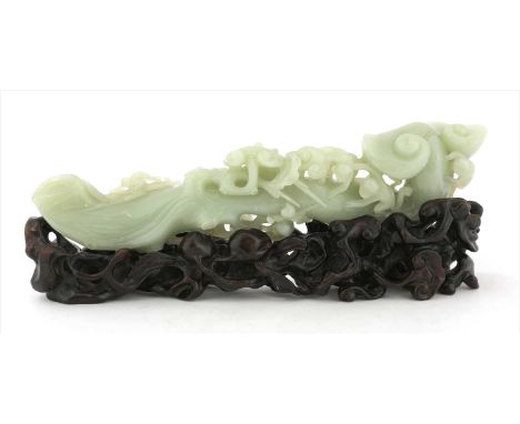 A Chinese jade carving, of monkeys clambering on a ruyi sceptre surrounded by lingzhi , the stone of greyish-green tone, 28cm