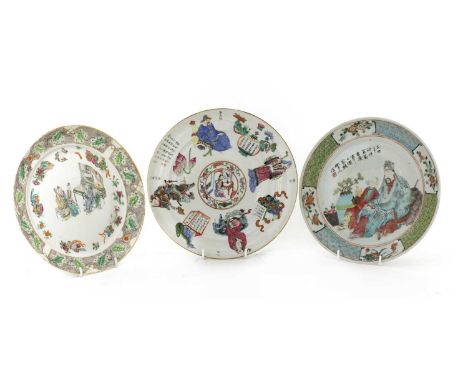 Three Chinese famille rose plates, 19th century, comprising: one painted with figures seated in a living room listening to yu