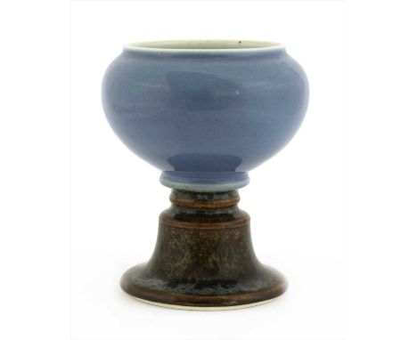 A Chinese porcelain lamp, Qing dynasty (1644-1911), of globular form on a waisted stem with flared base, the top section cove