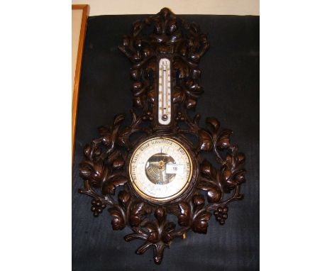 Decorative antique wall barometer/thermometer - carved Black Forest surround