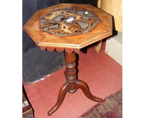 A 19th century octagonal specimen table on tripod support