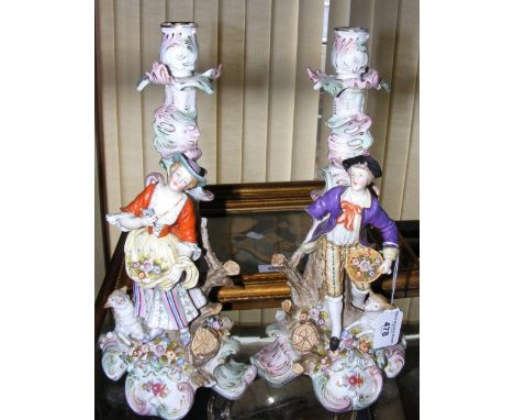 Pair of decorative Sitzendorf ceramic candlesticks with figural and floral decoration - 34cm high