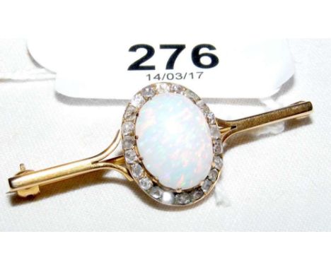 Opal and diamond brooch in gold setting