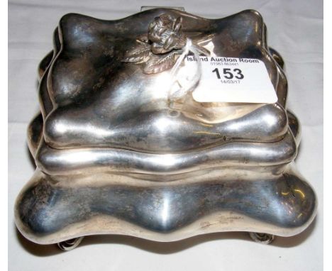 A shaped grade 3 silver tea caddy with hinged lid