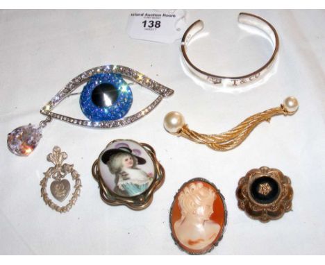 A Tiffany silver bangle, together with other brooches, etc.