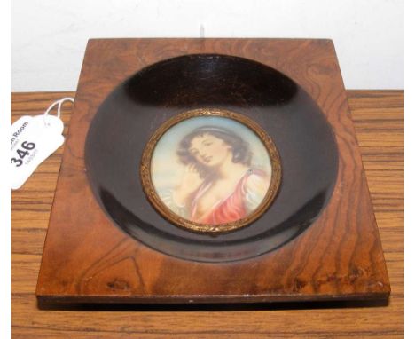 An oval portrait miniature of demure lady - bearing signature