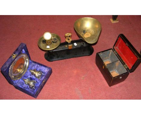 A set of scales with weights, tea caddy, etc.