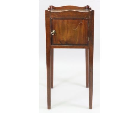 A George III style mahogany pot cupboard, the shaped tray top with cut out carrying handles, having a crossbanded door, on sq