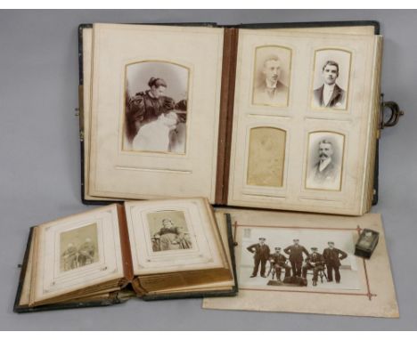 Two Victorian leather bound albums of carte de viste and cabinet photographs, portrait studies, an unframed photograph by Tim