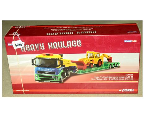 Corgi (Heavy Haulage) a boxed 1/50th scale CC14015 Volvo FH Nooteboom Low Loader and JCB 3C "W.H. Malcolm Ltd". Comes with nu