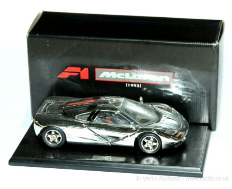 Gwilo a boxed 1/18th scale F1 McLaren (1993) with chrome plated finish and mounted on a plinth with chrome plaque (converted 