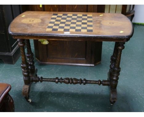 Inlaid chessboard topped mahogany side table on castors