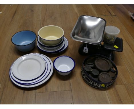 Box of blue and white enamel plates and bowls, set of weighing scales and tin of weights