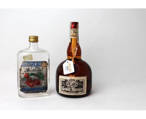 Vintage bottle of Grand Marnier liqueur and Kirsch liqueur