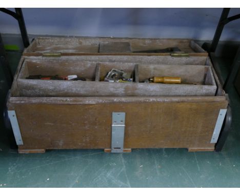 Vintage wooden toolbox with hand tools