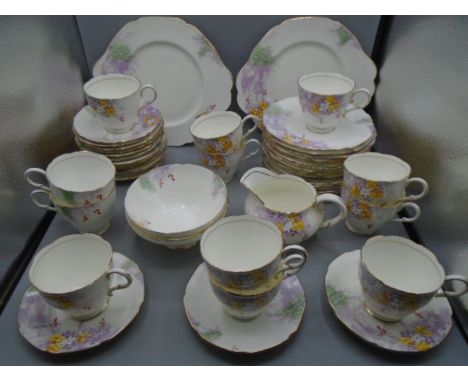 Paragon 'woodland bluebell' part tea service comprising 12 cups, 18 saucers, 17 cake plates, 2 cake/sandwich serving plates, 
