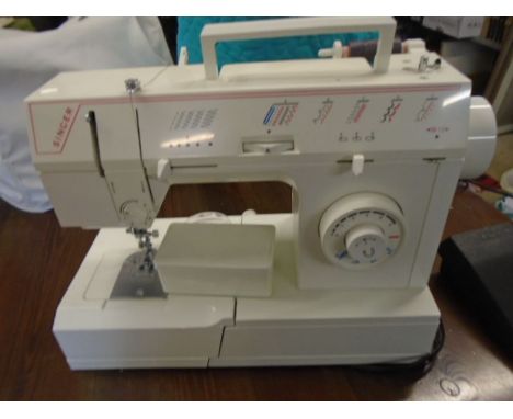 Singer electric sewing machine with manual and accessories