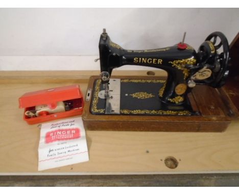 VINTAGE SINGER SEWING MACHINE IN CASE WITH KEY AND A BUTTON HOLE ATTACHMENT IN ORIGINAL BOX
