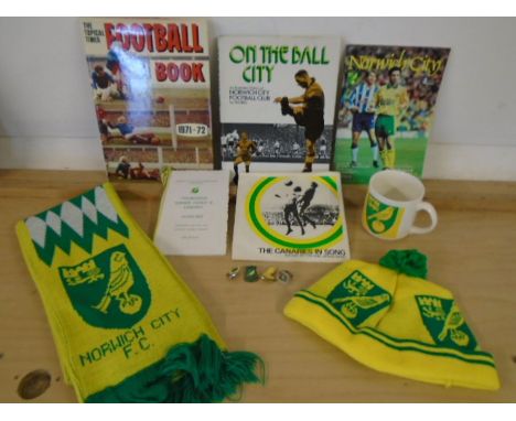 Norwich city football club memorabillia- 2 books, an invitation, a mug, a few brooches, scarf and a hat