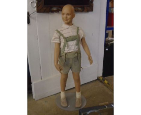 A male mannequin wearing lederhosen approx 48" tall