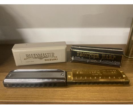 TWO HARMONICAS TO INCLUDE A SUZUKI BLUESMASTER IN KEY 'C' AND A FRONTIER HARP HARMONICA GOLD 