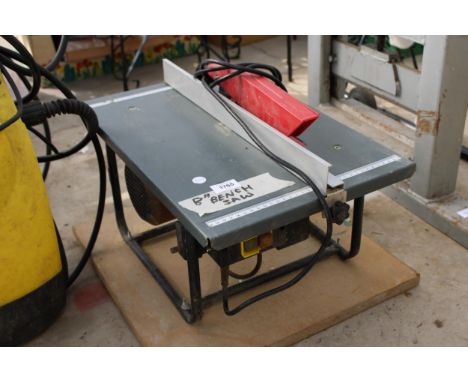 AN ELECTRIC 8" BENCH SAW 