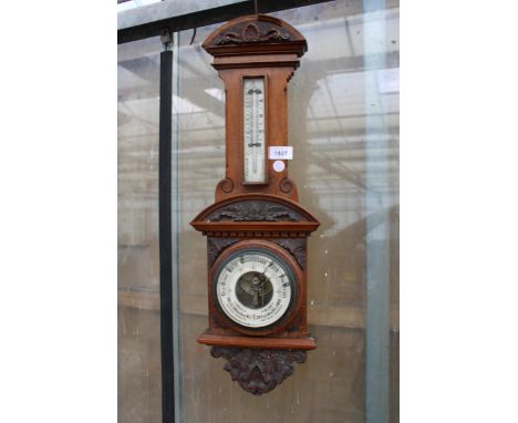 A VINTAGE WOODEN CASED BAROMETER 