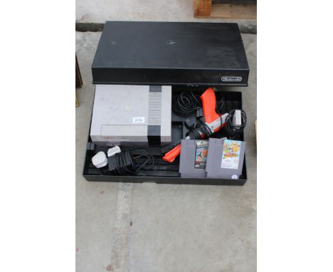 A NINTENDO ENTERTAINMENT SYSTEM GAMES CONSOLE WITH CONTROLLERS AND TWO GAMES 