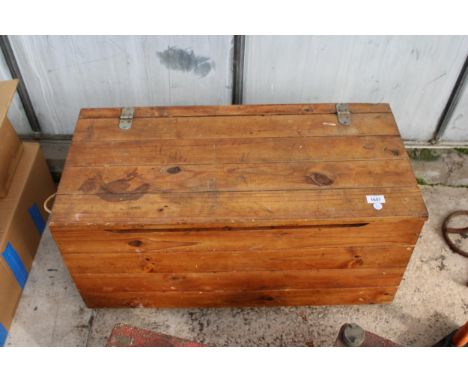 A PINE BLANKET/TOOL CHEST WITH WHEELS TO BASE 