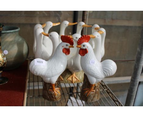 A LARGE CERAMIC DUCK BOWL AND TWO CERAMIC CHICKENS 