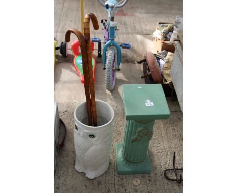 A CERAMIC JARDINAIRE STAND, A CERAMIC OWL STICK STAND AND TWO WALKING STICKS 