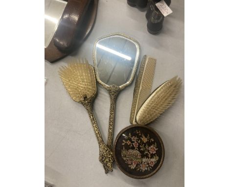 A VINTAGE PETIT POINT DRESSING TABLE SET TO INCLUDE BRUSHES, A COMB, HAND MIRROR AND TRINKET POT 