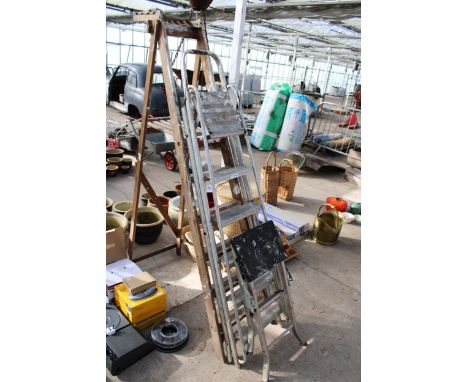 A VINTAGE WOODEN FIVE RUNG STEP LADDER, A FIVE RUNG ALUMINIUM STEP LADDER AND A FOLDING STEP STOOL 