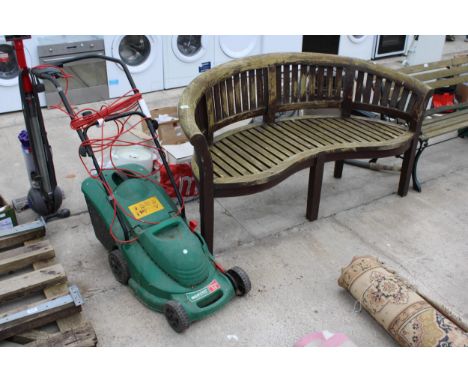 A WOODEN SLATTED CURVED GARDEN BENCH 