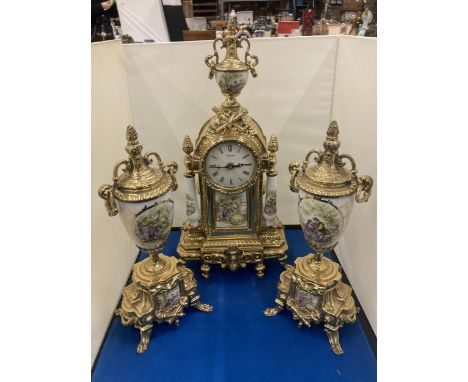 AN ROBERT GRANT OF LONDON ORNATE BRASS CLOCK WITH CERAMIC PILLARS AND INSERT OF A COURTING COUPLE COMPLETE WITH A PAIR OF MAT