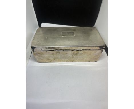 A LARGE HALLMARKED BIRMINGHAM SILVER CIGARETTE BOX ENGRAVED TO THE LID WITH WOOD LINING 