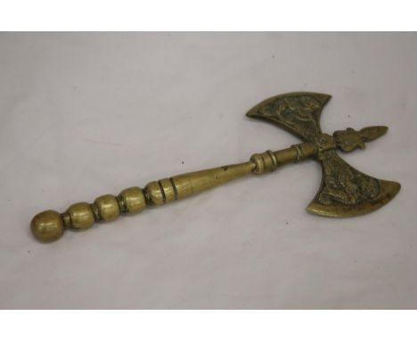 A SOLID BRASS DOUBLE SIDED BATTLE AXE 
