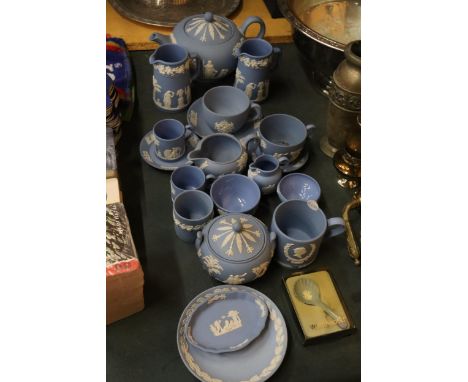 A COLLECTION OF POWDER BLUE WEDGWOOD JASPERWARE TO INCLUDE A TEAPOT, CUPS, SAUCERS, JUGS, BOWLS, ETC 