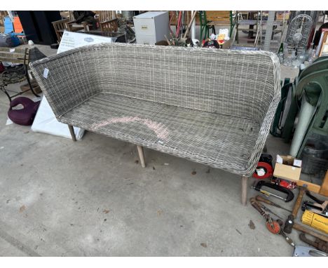 A LARGE WICKER THREE SEATER BENCH 