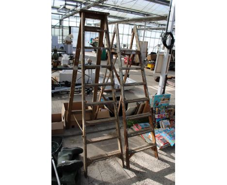 A VINTAGE 8 RUNG WOODEN STEP LADDER AND A FURTHER SIX RUNG WOODEN STEP LADDER 