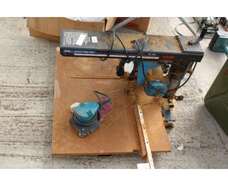 A RYOBI RADIAL ARM SAW AND A PALM SANDER 