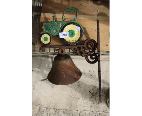 A CAST IRON JOHN DEERE TRACTOR BELL 