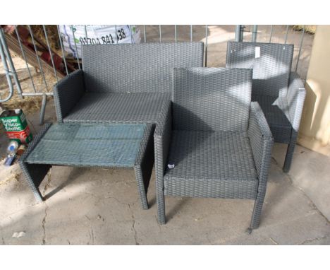 A RATTAN GARDEN FURNITURE SET COMPRISING OF A TWO SEATER BENCH, TWO CHAIRS AND A COFFEE TABLE 