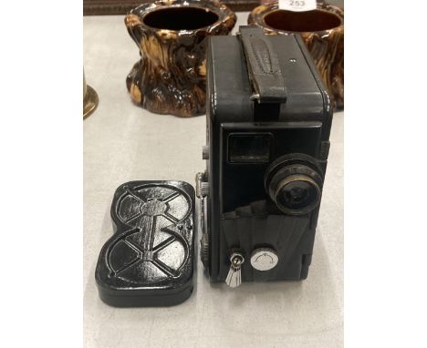 A VINTAGE BAKELITE DEKKO CINE CAMERA AND FILM 