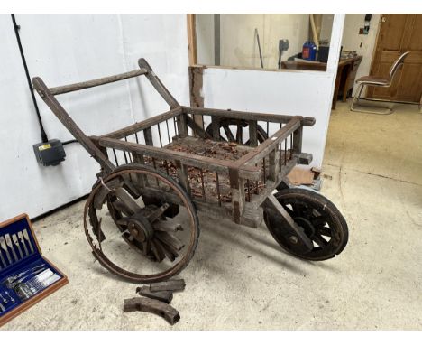 A VINTAGE INDIAN THREE WHEELED HAND CART (ONE WHEEL REQUIRES REPAIR) 