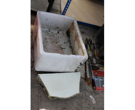 A WHITE BELFAST SINK AND A DECORATIVE WOODEN WALL SHELF 