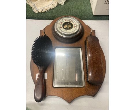 A VINTAGE OAK HALL MIRROR WITH BAROMETER AND BRUSH 