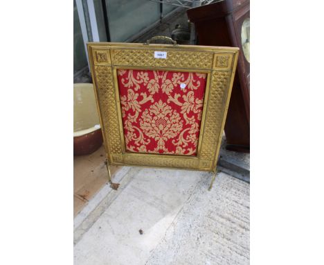 A DECORATIVE BRASS FIRE SCREEN WITH A TAPESTRY CENTRE 