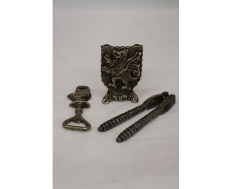 A GRYPHON DOOR STOP TOGETHER WITH A KNIGHT BOTTLE OPENER AND VICTORIAN NUT CRACKER 